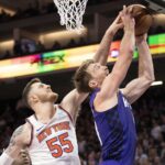 New York Knicks center Isaiah Hartenstein (55) blocks the shot attempt by Sacramento Kings forward Domantas Sabonis (10) during the fourth quarter at Golden 1 Center.