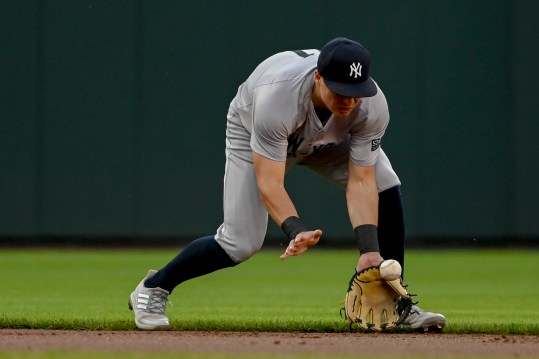 May 1, 2024; Baltimore, Maryland, USA; New York Yankees shortstop Anthony Volpe (11) fields a ground ball during the first inning against the Baltimore Orioles  at Oriole Park at Camden Yards. Mandatory Credit: Tommy Gilligan-USA TODAY Sports