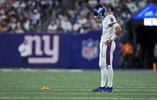 Sep 26, 2022; East Rutherford, New Jersey, USA;  New York Giants quarterback Daniel Jones (8) reacts to an intentional grounding penalty flag during the second half against the Dallas Cowboys at MetLife Stadium. Mandatory Credit: Brad Penner-USA TODAY Sports