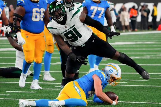 Nov 6, 2023; East Rutherford, New Jersey, USA; New York Jets defensive end John Franklin-Myers (91) reacts after sacking Los Angeles Chargers quarterback Justin Herbert (10) during a football game at MetLife Stadium. Mandatory Credit: Robert Deutsch-USA TODAY Sports