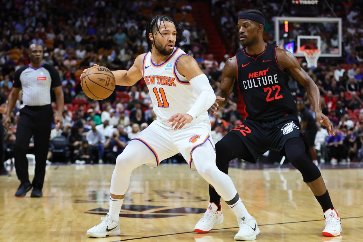 NBA: New York Knicks at Miami Heat Apr 2, 2024; Miami, Florida, USA; New York Knicks guard Jalen Brunson (11) dribbles the basketball as Miami Heat forward Jimmy Butler (22) defends during the first quarter at Kaseya Center. Mandatory Credit: Sam Navarro-Imagn Images