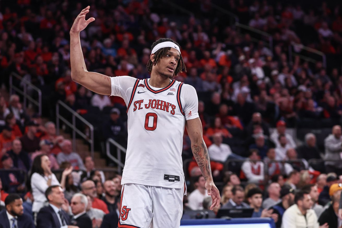 Nov 17, 2024; New York, New York, USA; St. John’s Red Storm guard Aaron Scott (0) waves to the fans in the second half against the New Mexico Lobos at Madison Square Garden. Mandatory Credit: Wendell Cruz-Imagn Images
