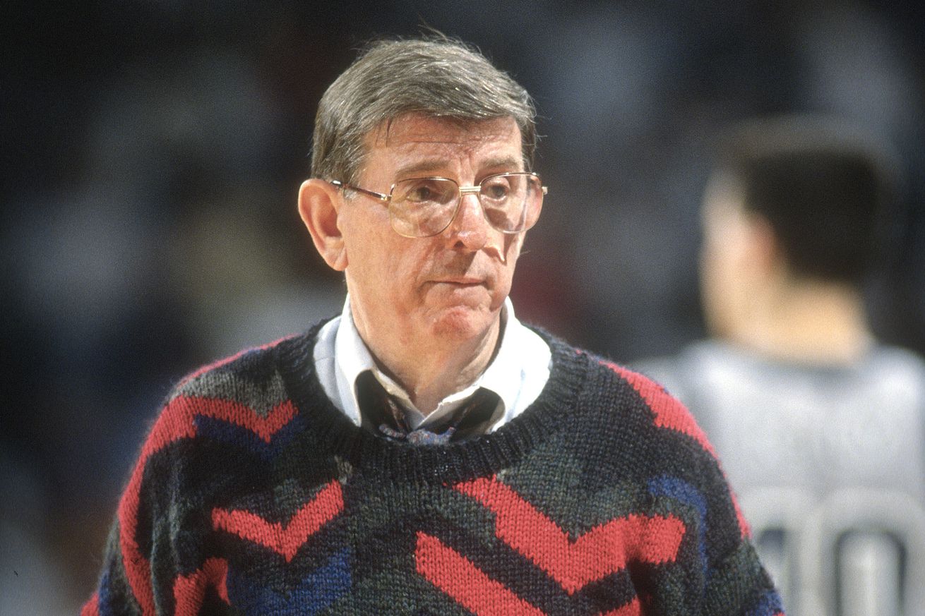 LANDOVER, MD - CIRCA 1991: Head coach Lou Carnesecca of the St. John’s Red Storm looks on against the Georgetown Hoyas during an NCAA College basketball game circa 1991 at the Capital Centre in Landover, Maryland. Carnesecca coached at St. John’s from 1965-70 and 1973-92.