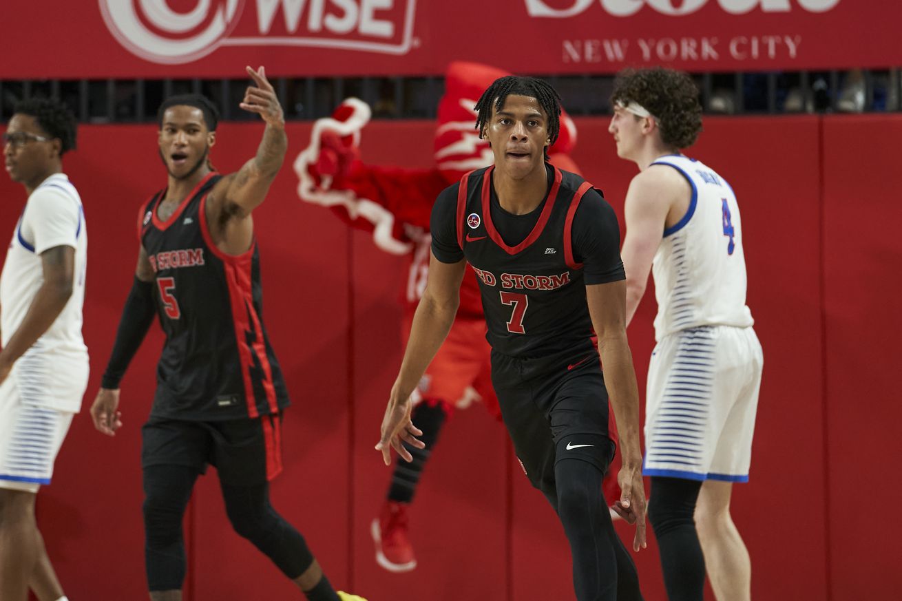 From left to right: Deivon Smith (#5) points down the court as Simeon Wilcher (#7) celebrates a made three-pointer in the St. John’s Red Storm vs. DePaul Blue Demons men’s basketball game at Carnesecca Arena in Queens, New York on Tuesday, December 17, 2024.