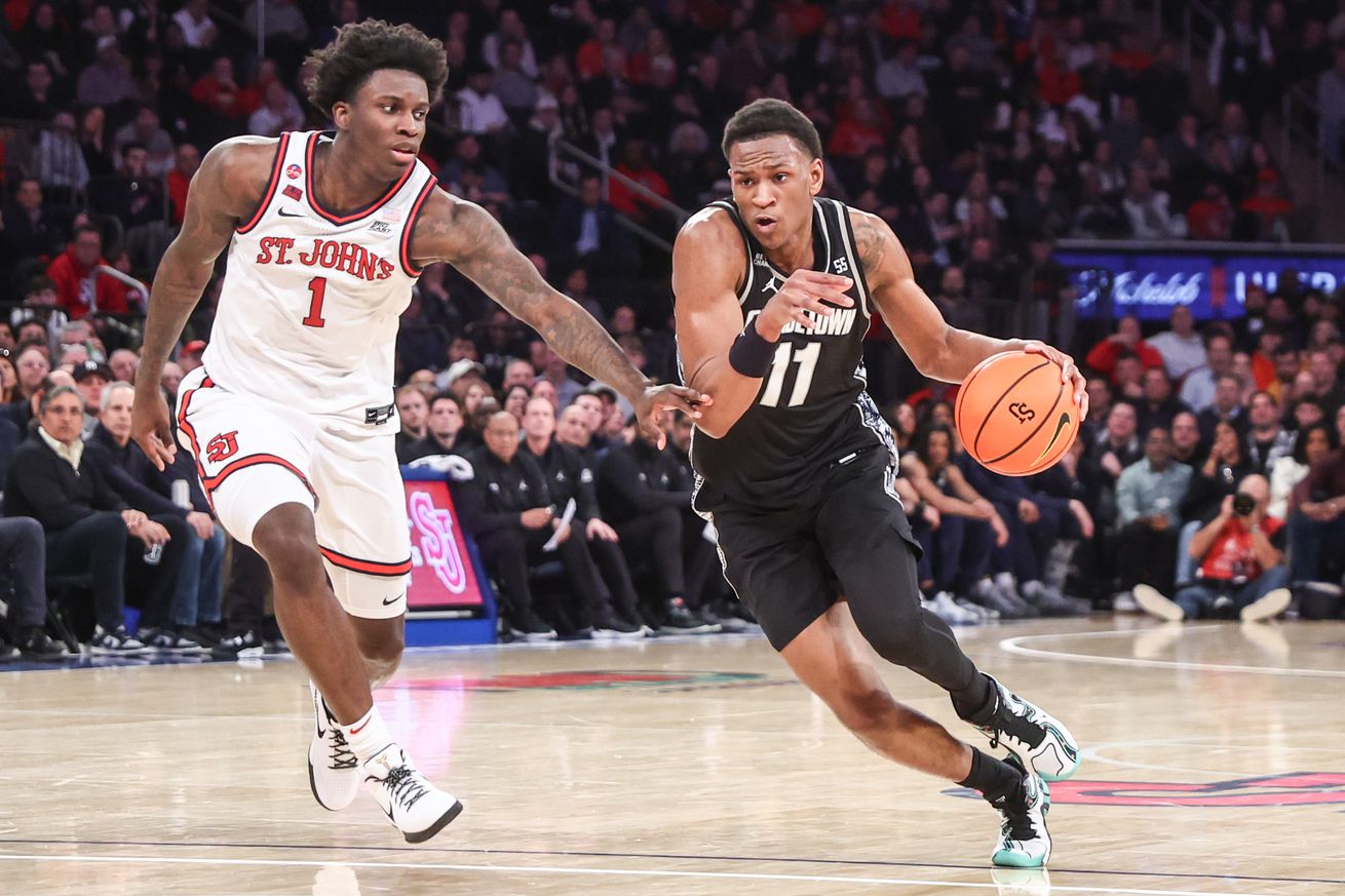 Jan 14, 2025; New York, New York, USA; Georgetown Hoyas guard Curtis Williams Jr. (11) drives past St. John’s Red Storm guard Kadary Richmond (1) in the first half at Madison Square Garden. Mandatory Credit: Wendell Cruz-Imagn Images