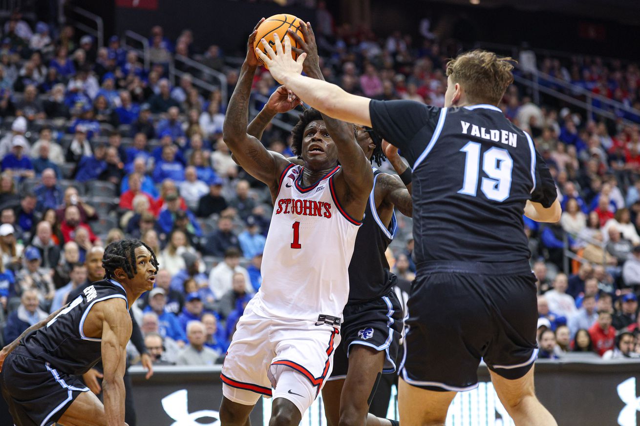 Newark, New Jersey, USA; St. John’s Red Storm guard Kadary Richmond (1) drives to the basket as Seton Hall Pirates forward Gus Yalden (19) defends during the first half at Prudential Center. Mandatory Credit: Vincent Carchietta-Imagn Images
