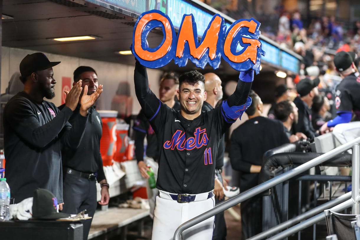 Jul 12, 2024; New York City, New York, USA; New York Mets second baseman Jose Iglesias (11) celebrates in the dugout after hitting a solo home run in the fifth inning against the Colorado Rockies at Citi Field. Mandatory Credit: Wendell Cruz-USA TODAY Sports
