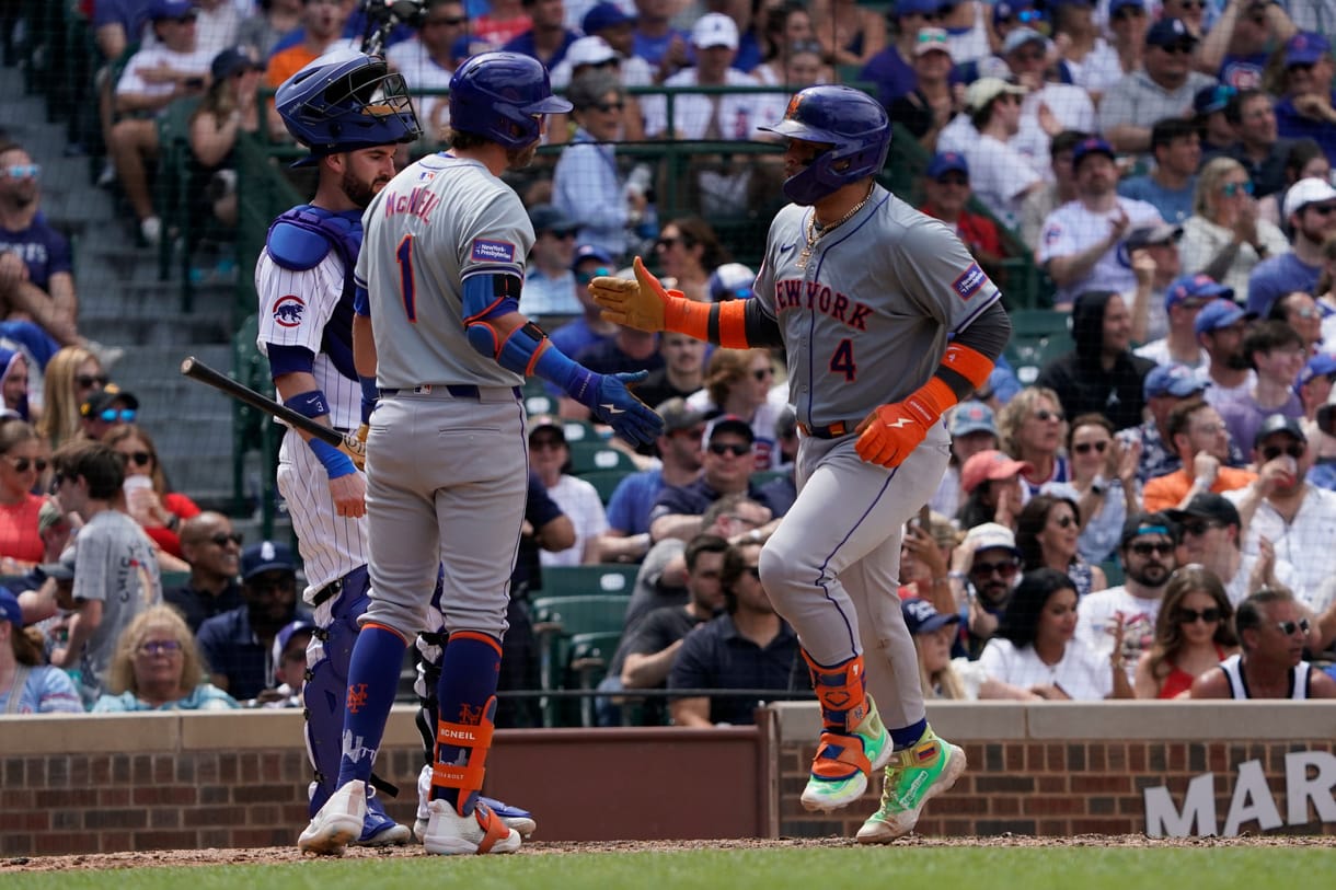 MLB: New York Mets at Chicago Cubs Jun 22, 2024; Chicago, Illinois, USA; New York Mets catcher Francisco Alvarez (4) is greeted by second baseman Jeff McNeil (1) after hitting a home run against the Chicago Cubs during the fifth inning at Wrigley Field. Mandatory Credit: David Banks-USA TODAY Sports