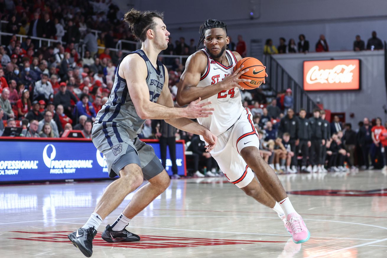 Jan 4, 2025; Queens, New York, USA; St. John’s Red Storm forward Zuby Ejiofor (24) drives past Butler Bulldogs forward Boden Kapke (33) in the second half at Carnesecca Arena. Mandatory Credit: Wendell Cruz-Imagn Images