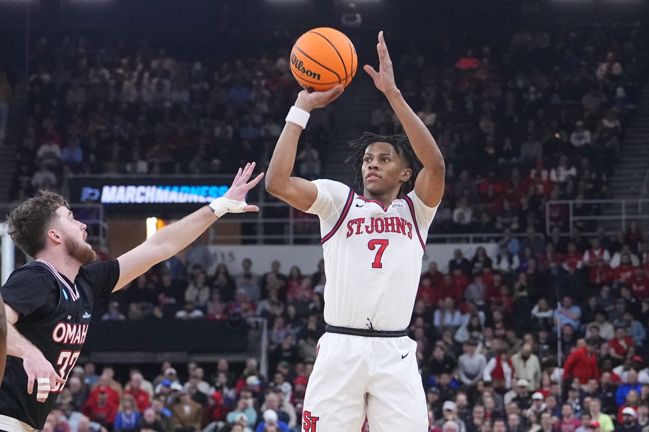 Mar 20, 2025; Providence, RI, USA; St. John’s Red Storm guard Simeon Wilcher (7) controls the ball against Omaha Mavericks guard Tony Osburn (32) during the first half at Amica Mutual Pavilion. Mandatory Credit: Gregory Fisher-Imagn Images