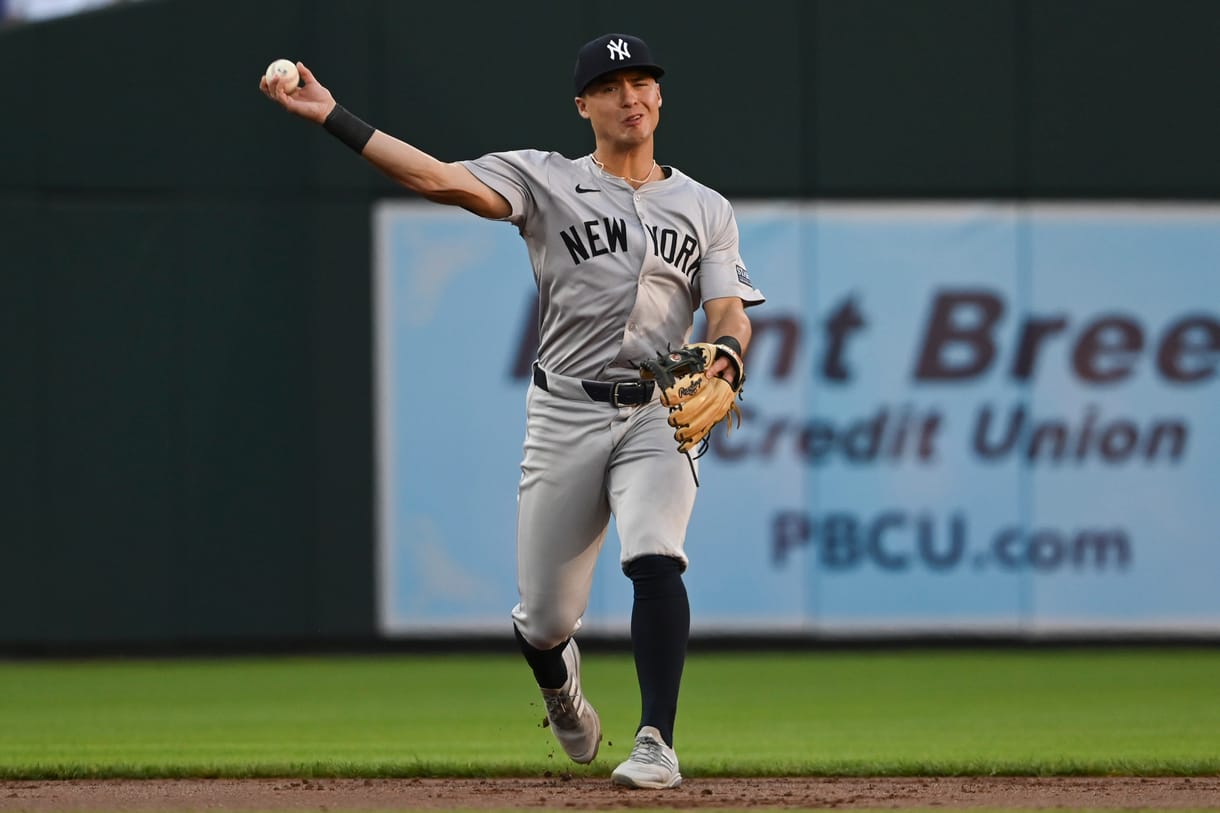 May 1, 2024; Baltimore, Maryland, USA; New York Yankees shortstop Anthony Volpe (11) throws to first base during the first inning against the Baltimore Orioles at Oriole Park at Camden Yards. Mandatory Credit: Tommy Gilligan-USA TODAY Sports