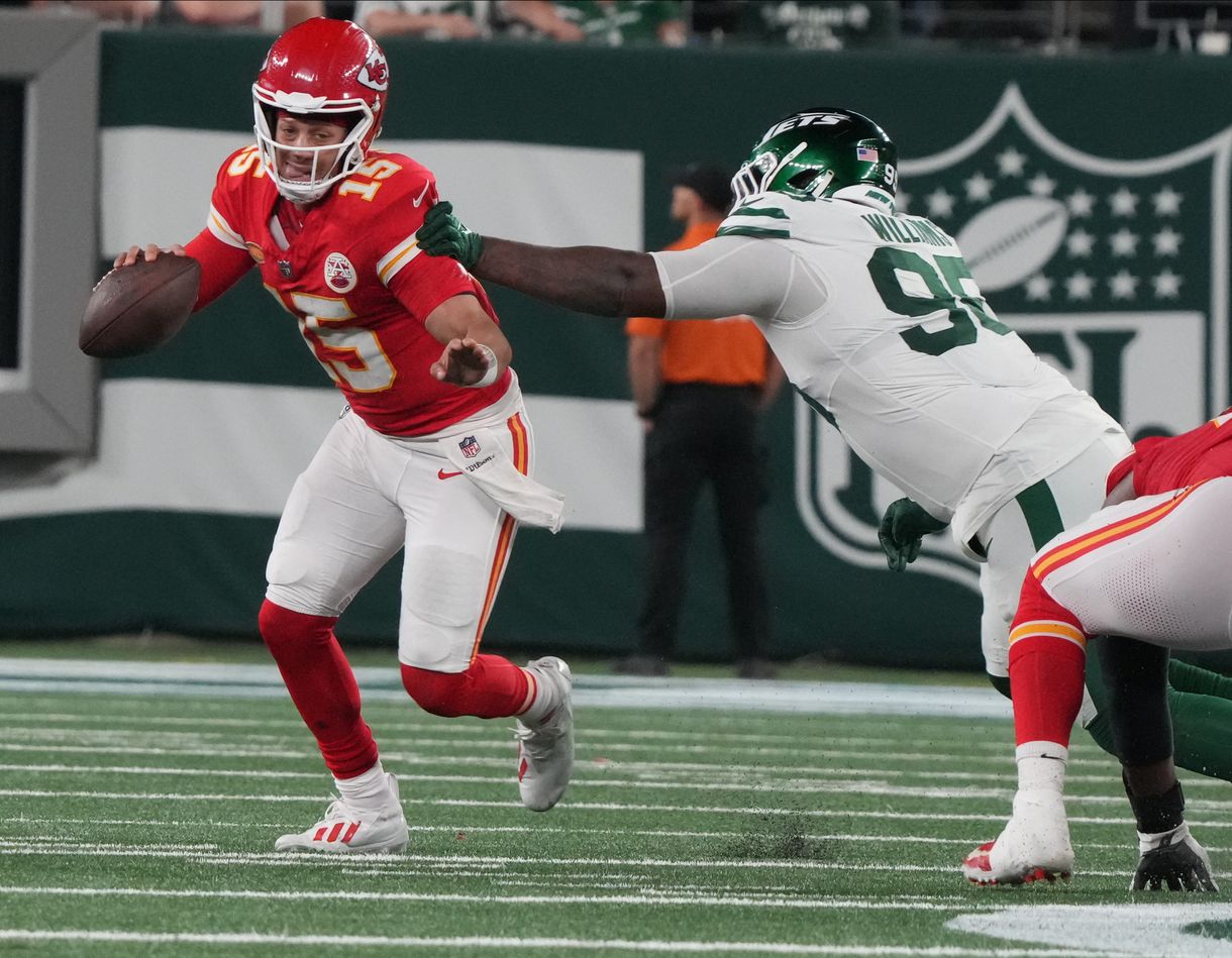 East Rutherford, NJ October 1, 2023 Chiefs quarterback Patrick Mahomes gets out of the grasp of Quinnen Williams of the Jets in the second half. The New York Jets host the Kansas City Chiefs at MetLife Stadium in East Rutherford, NJ on October 1, 2023.