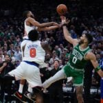 May 7, 2025; Boston, Massachusetts, USA; New York Knicks forward Mikal Bridges (25) defends against Boston Celtics forward Jayson Tatum (0) in the last seconds of the fourth quarter during game two of the second round for the 2025 NBA Playoffs at TD Garden. Mandatory Credit: David Butler II-Imagn Images