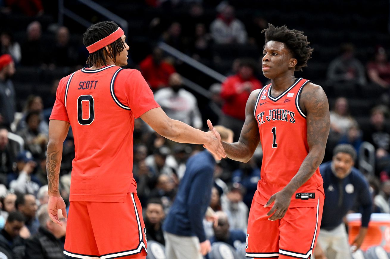 WASHINGTON, DC - JANUARY 28: Aaron Scott #0 and Kadary Richmond #1 of the St. John’s Red Storm celebrate during the game against the Georgetown Hoyas at Capital One Arena on January 28, 2025 in Washington, DC.