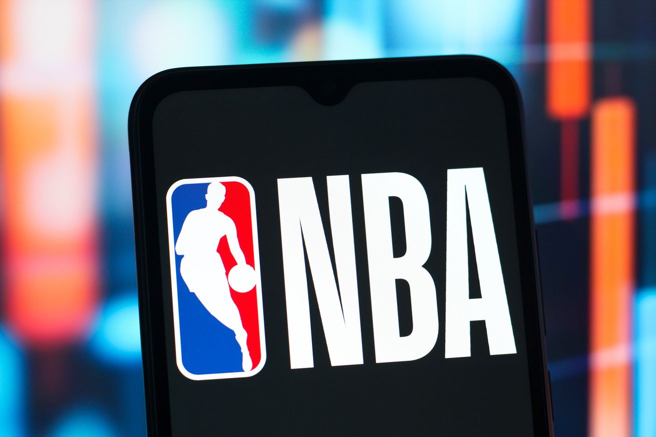 In this photo illustration, the NBA (National Basketball...