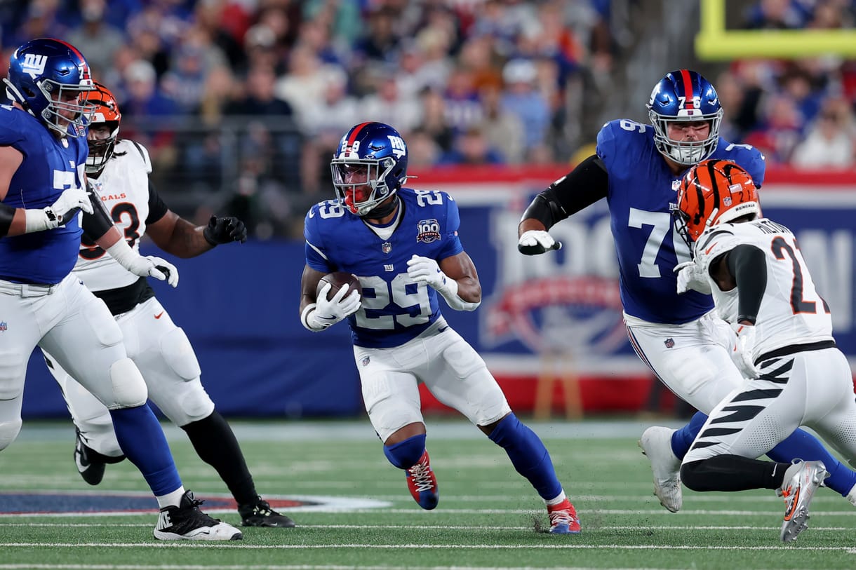 NFL: Cincinnati Bengals at New York Giants Oct 13, 2024; East Rutherford, New Jersey, USA; New York Giants running back Tyrone Tracy Jr. (29) runs with the ball against the Cincinnati Bengals during the first quarter at MetLife Stadium. Mandatory Credit: Brad Penner-Imagn Images