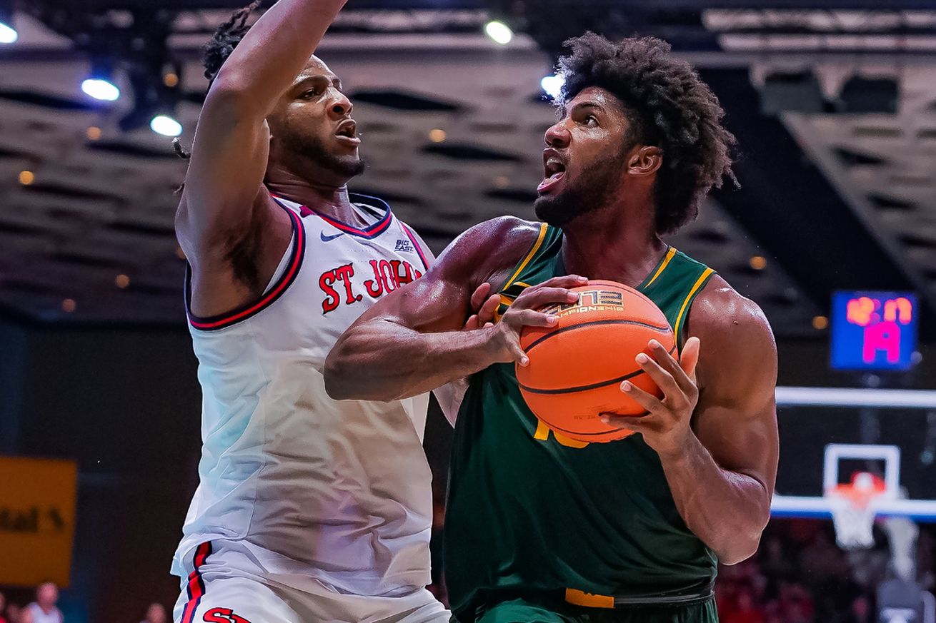 Baylor’s Norchad Omier drives with the ball towards St. John’s Zuby Ejiofor during the semifinal of the 2024 Baha Mar Bahamas Championship between the St. John’s Red Storm vs. Baylor Bears men’s basketball teams at the Baha Mar Convention Center in Nassau, Bahamas on Thursday, November 21, 2024. Photo by Baylor Athletics.