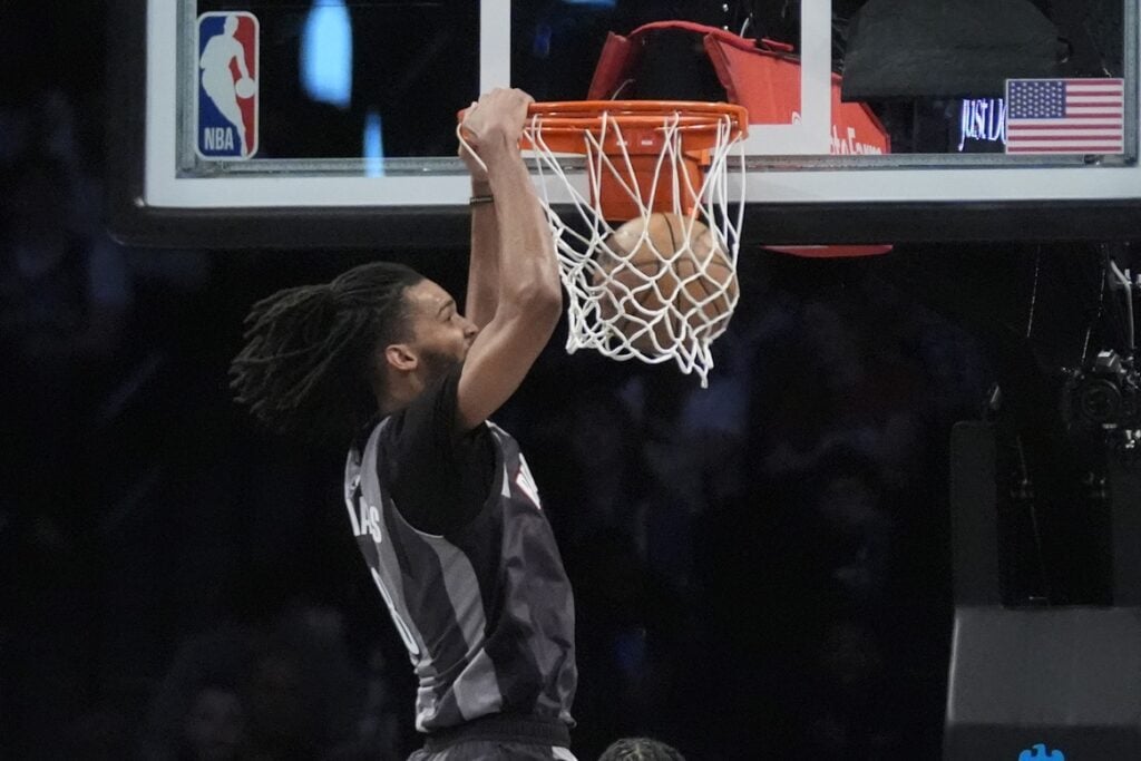 Apr 6, 2025; Brooklyn, New York, USA; Brooklyn Nets forward Ziaire Williams (8) dunks the ball against the Toronto Raptors during the first half at Barclays Center. Mandatory Credit: Gregory Fisher-Imagn Images