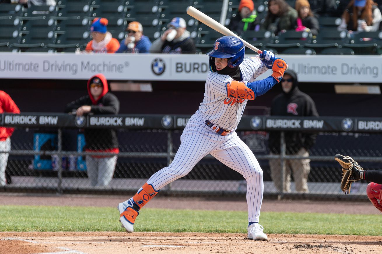 Drew Gilbert bats in a home Syracuse Mets uniform