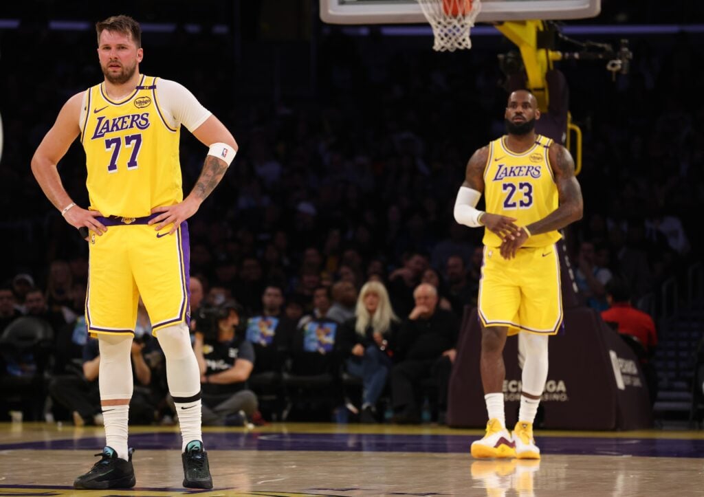 Los Angeles Lakers forward LeBron James (23) and guard Luka Doncic (77) during the first quarter against the Charlotte Hornets