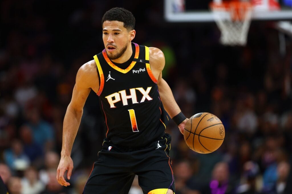 Apr 9, 2025; Phoenix, Arizona, USA; Phoenix Suns guard Devin Booker (1) dribbles the ball against the Oklahoma City Thunder during the first half at Footprint Center. Mandatory Credit: Mark J. Rebilas-Imagn Images