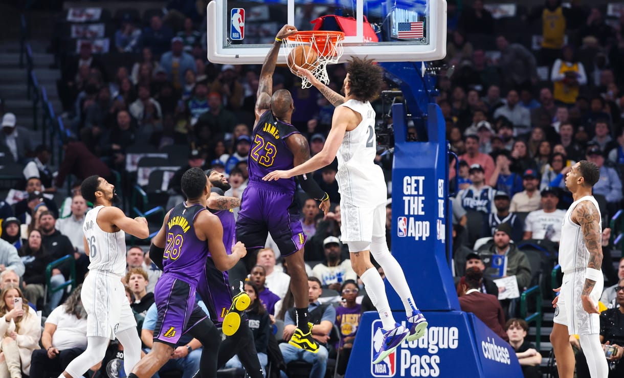 Jan 7, 2025; Dallas, Texas, USA; Los Angeles Lakers forward LeBron James (23) dunks past Dallas Mavericks center Dereck Lively II (2) during the first quarter at American Airlines Center. Mandatory Credit: Kevin Jairaj-Imagn Images