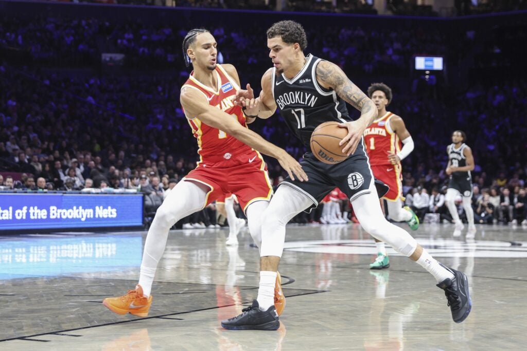 Brooklyn Nets forward Michael Porter Jr. (17) looks to drive past Atlanta Hawks forward Zaccharie Risacher (10) in the second quarter at Barclays Center.