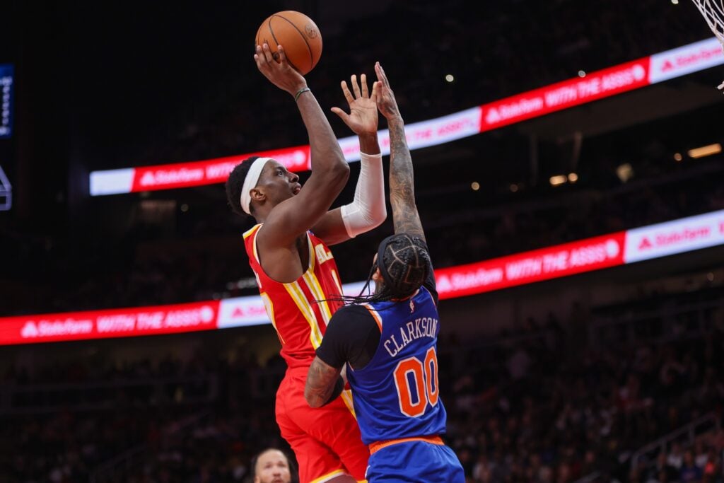 Atlanta Hawks forward Onyeka Okongwu (17) shoots over New York Knicks guard Jordan Clarkson (00) in the fourth quarter at State Farm Arena.