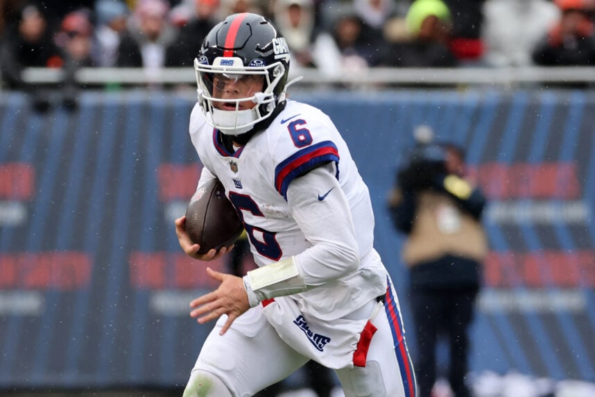 Nov 9, 2025; Chicago, Illinois, USA; New York Giants quarterback Jaxson Dart (6) rushes the ball against the Chicago Bears during the second half at Soldier Field. Mandatory Credit: Mike Dinovo-Imagn Images
