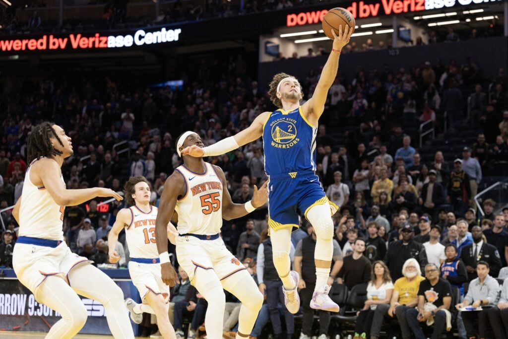 Jan 15, 2026; San Francisco, California, USA; Golden State Warriors guard Brandin Podziemski (2) lays the ball up defended by New York Knicks center Ariel Hukporti (55) during the fourth quarter at Chase Center. Mandatory Credit: D. Ross Cameron-Imagn Images