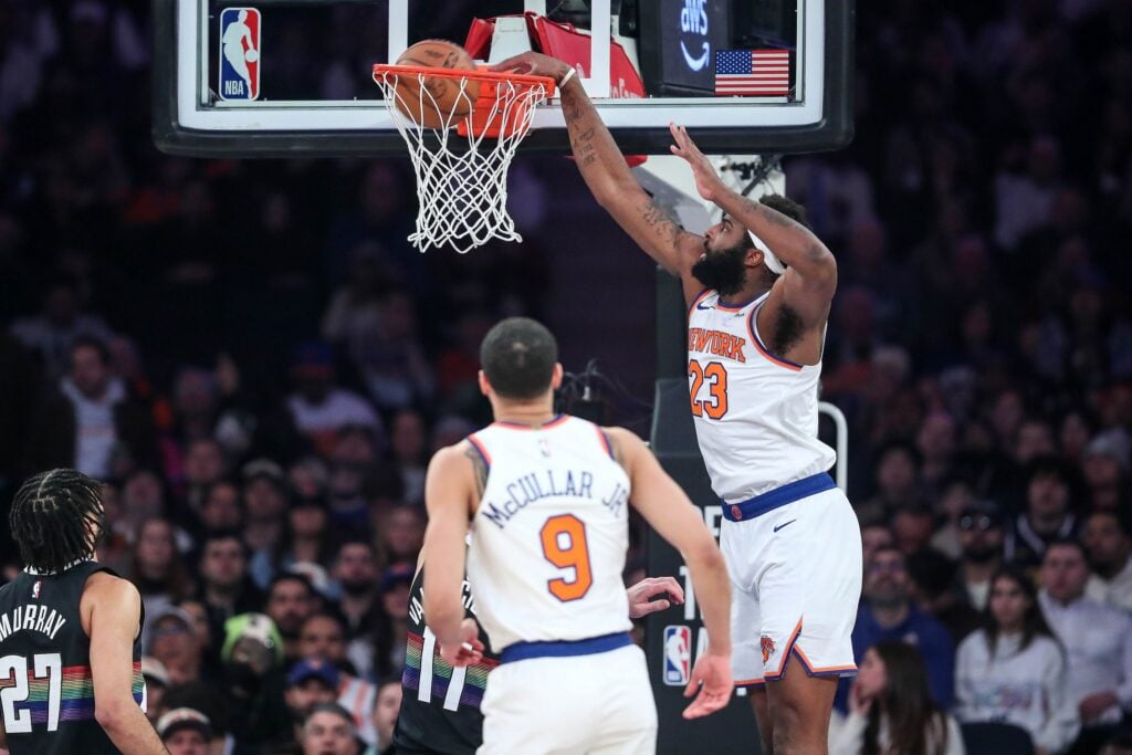 Feb 4, 2026; New York, New York, USA; New York Knicks center Mitchell Robinson (23) dunks in the first quarter against the Denver Nuggets at Madison Square Garden. Mandatory Credit: Wendell Cruz-Imagn Images